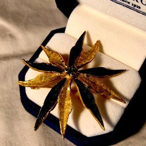 Brooch, black and gold plated